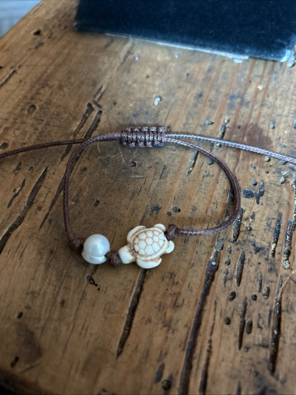 Brown Cord Bracelet with Carved Turtle and Pearl Accent